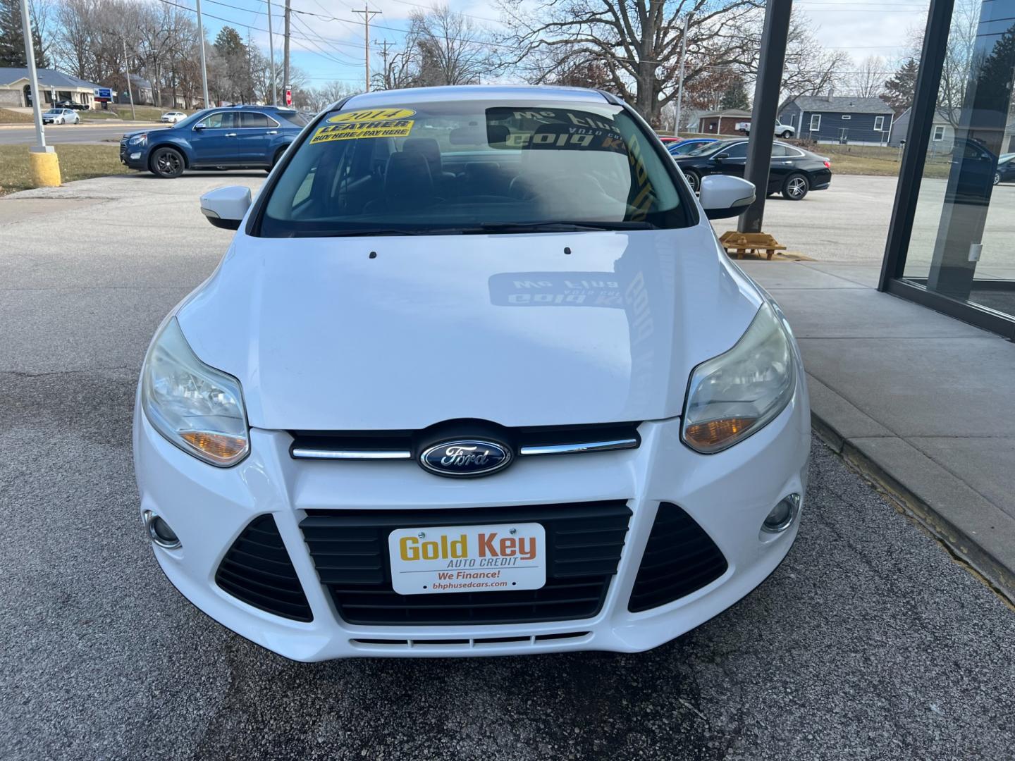 2014 Oxford White Ford Focus SE Sedan (1FADP3F26EL) with an 2.0L L4 DOHC 16V engine, 6-Speed Automatic transmission, located at 1633 W Kimberly, Davenport, IA, 52806, (563) 323-5341, 41.559456, -90.598732 - Photo#1